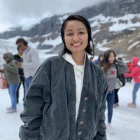 Jen is pictured hiking in a snowy environment.